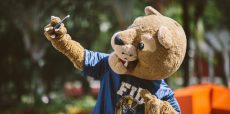 FIU Panther mascot Roary holding up cellphone taking a selfie