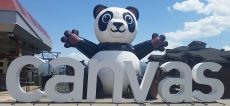 Large inflatable panda with "canvas" in white letters