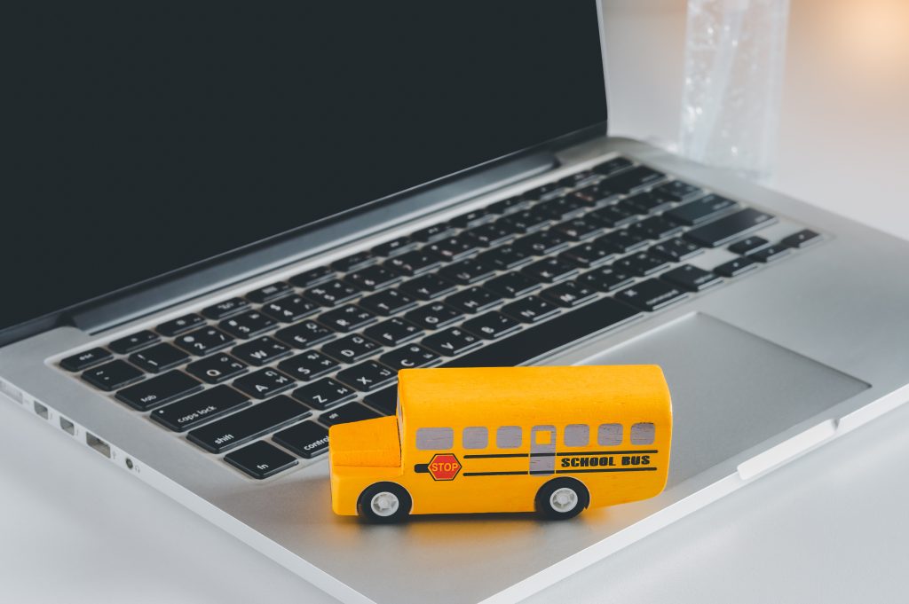 Yellow school bus on laptop.